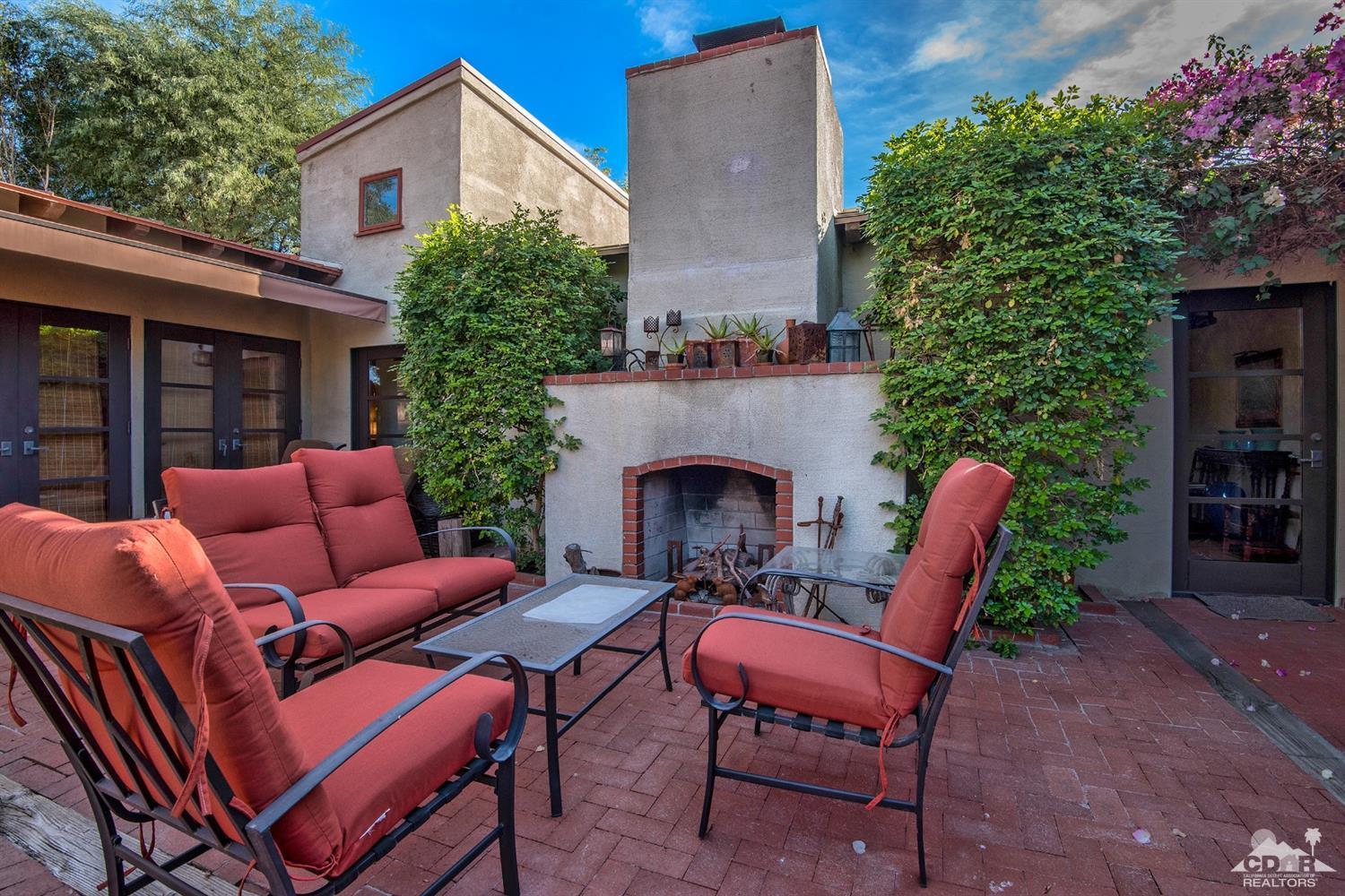 72220 Rancho Road Rancho Mirage, CA 92270 - Photo 2 of 24 a backyard of a house with outdoor seating