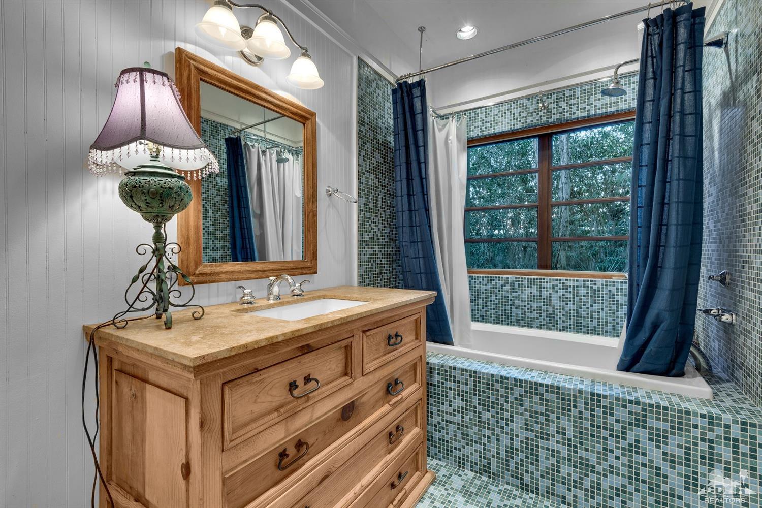 72220 Rancho Road Rancho Mirage, CA 92270 - Photo 11 of 24 a bathroom with a sink and a mirror
