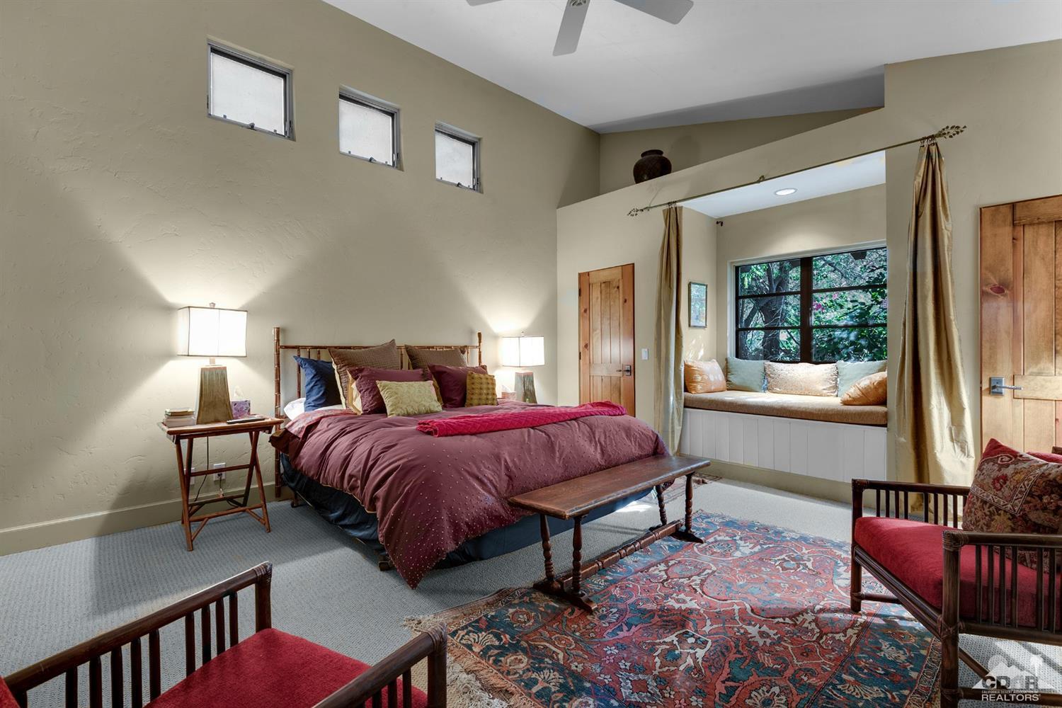 72220 Rancho Road Rancho Mirage, CA 92270 - Photo 14 of 24 a spacious bedroom with a bed and a window