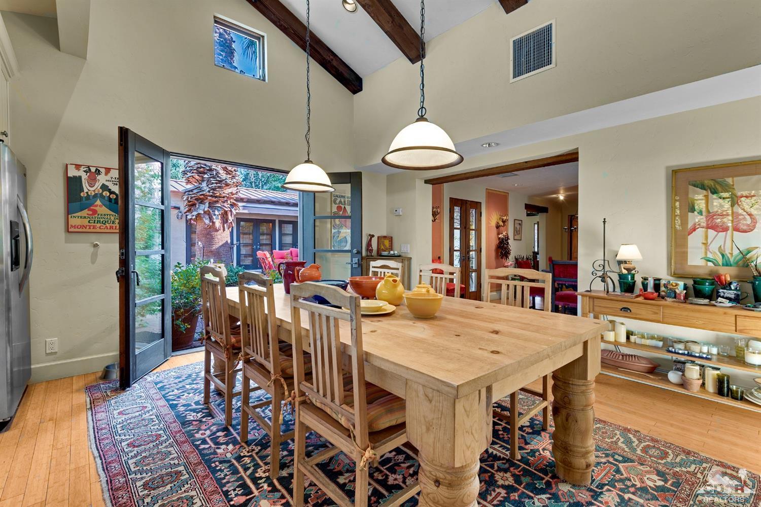 72220 Rancho Road Rancho Mirage, CA 92270 - Photo 17 of 24 a view of a dining room with furniture window and wooden floor