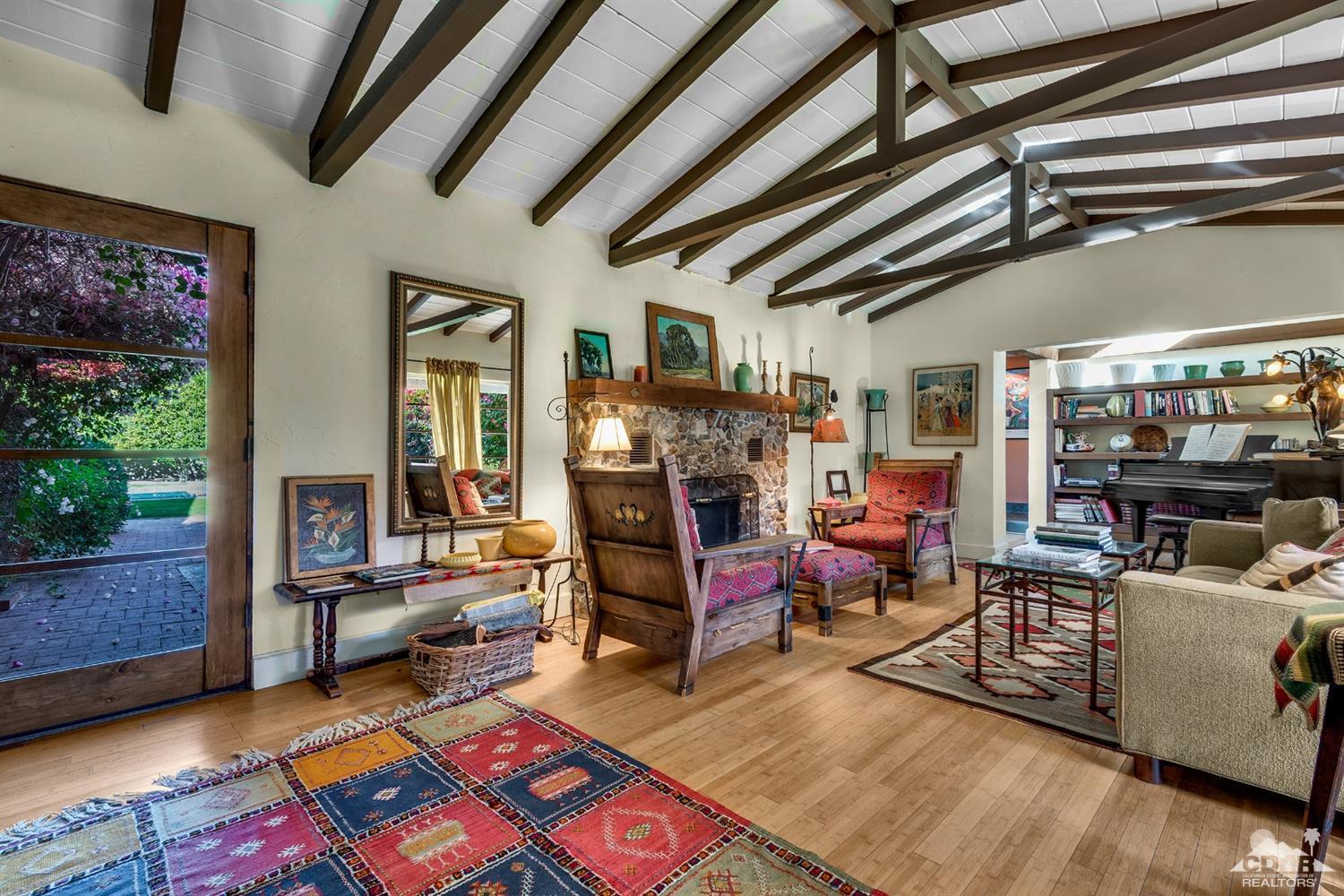 72220 Rancho Road Rancho Mirage, CA 92270 - Photo 20 of 24 a living room with furniture and a fireplace