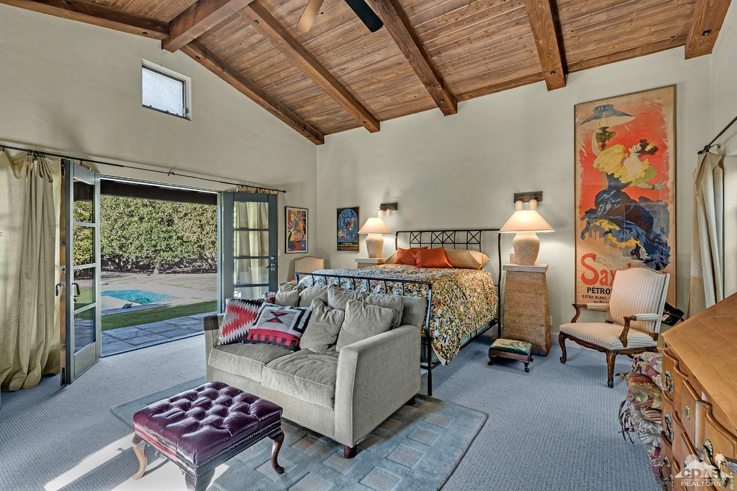 72220 Rancho Road Rancho Mirage, CA 92270 - Photo 23 of 24 a bedroom with furniture and a couch