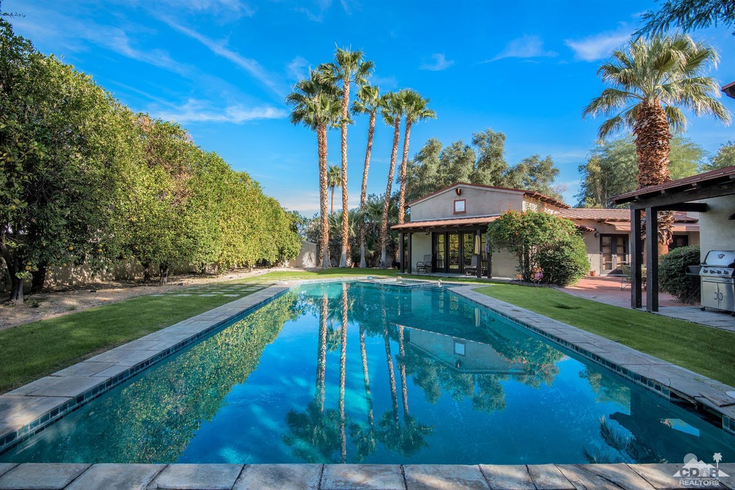 72220 Rancho Road Rancho Mirage, CA 92270 - Photo 24 of 24 a view of a house with a swimming pool