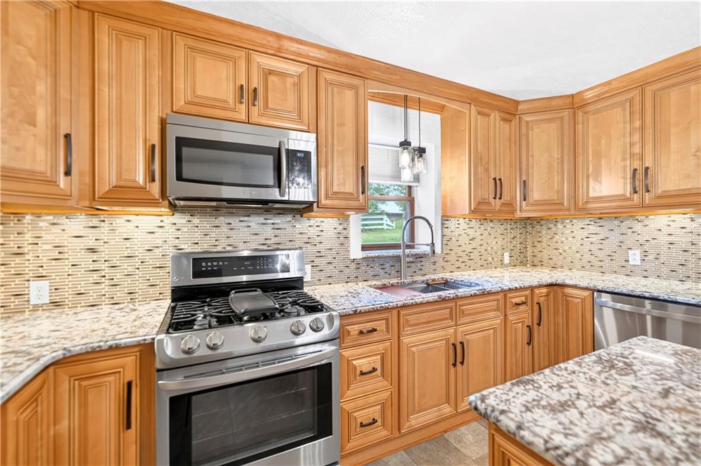 1301 Langeloth Road Burgettstown, PA 15021 - Photo 17 of 50 Custom sink with built-in cutting board, drying rack, and more...