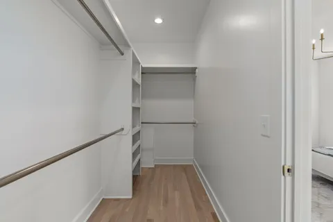 a kitchen with white cabinets and a sink