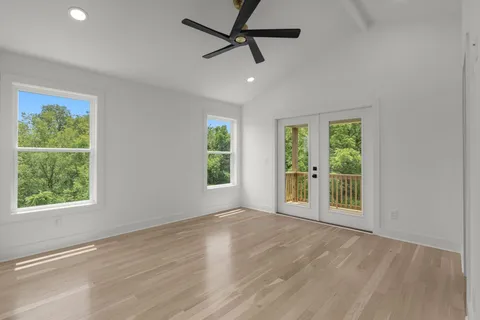 a balcony with furniture and wooden floor