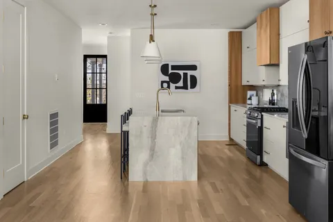 a view of balcony with wooden floor