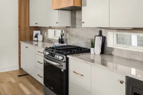 a bathroom with a double vanity sink and a mirror