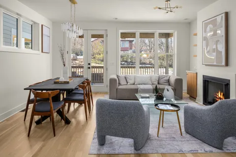 a bathroom with a granite countertop shower and toilet