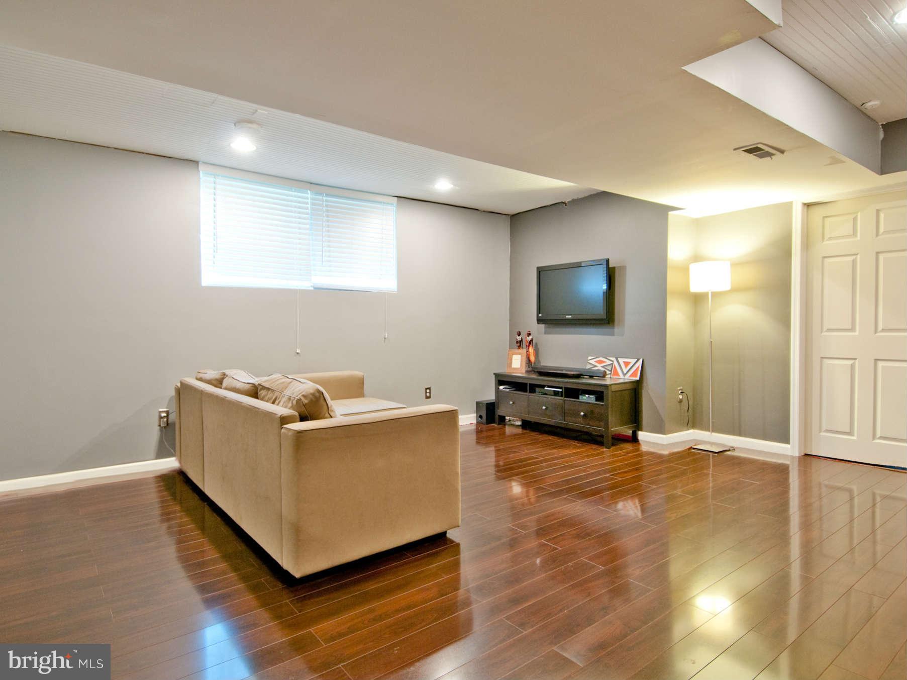 3614 Ednor Road Baltimore, MD 21218 - Photo 14 of 30 a living room with furniture and a flat screen tv