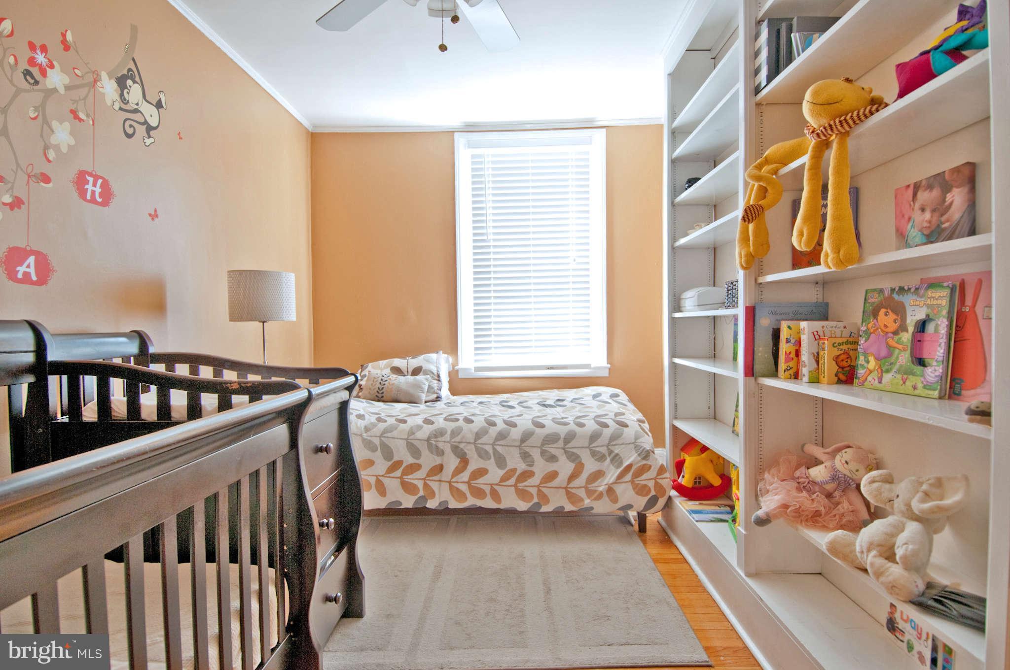 3614 Ednor Road Baltimore, MD 21218 - Photo 22 of 30 a bedroom with furniture and a window