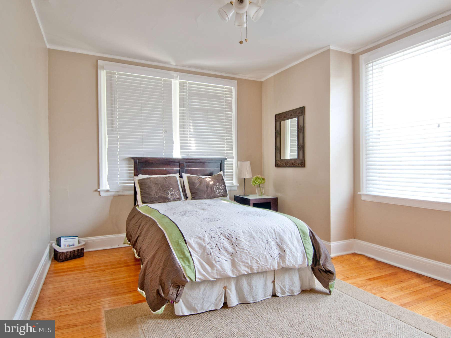 3614 Ednor Road Baltimore, MD 21218 - Photo 23 of 30 a bedroom with a bed and window