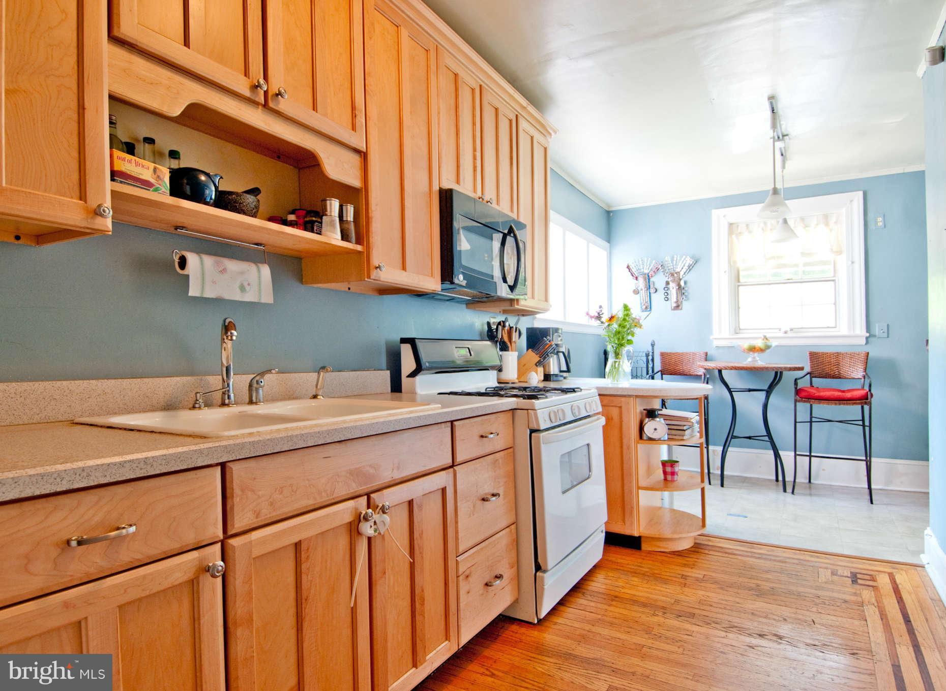3614 Ednor Road Baltimore, MD 21218 - Photo 4 of 30 a kitchen with a sink cabinets and window