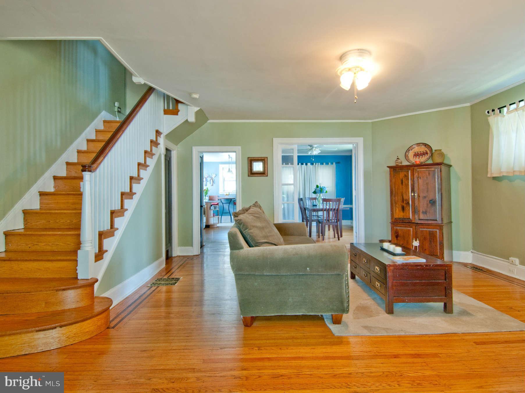 3614 Ednor Road Baltimore, MD 21218 - Photo 6 of 30 a living room with furniture and a wooden floor