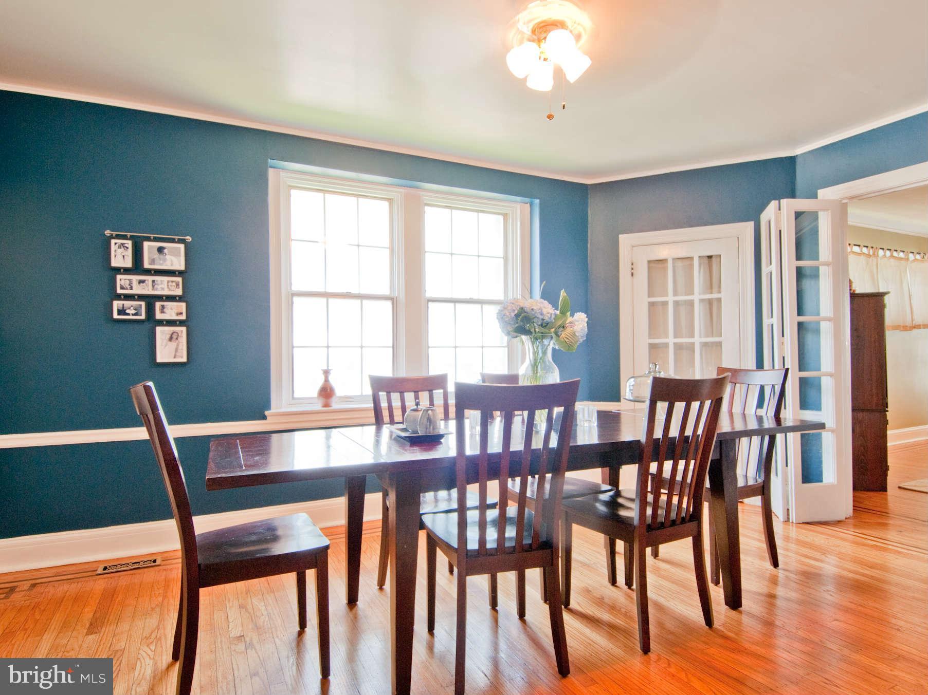 3614 Ednor Road Baltimore, MD 21218 - Photo 10 of 30 a view of a dining room with furniture window and wooden floor