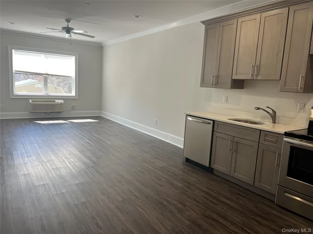 a view of a kitchen with electric appliances