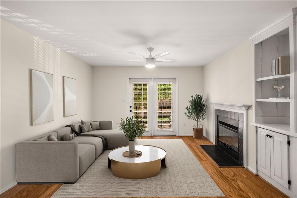 a living room with furniture a window and a fireplace