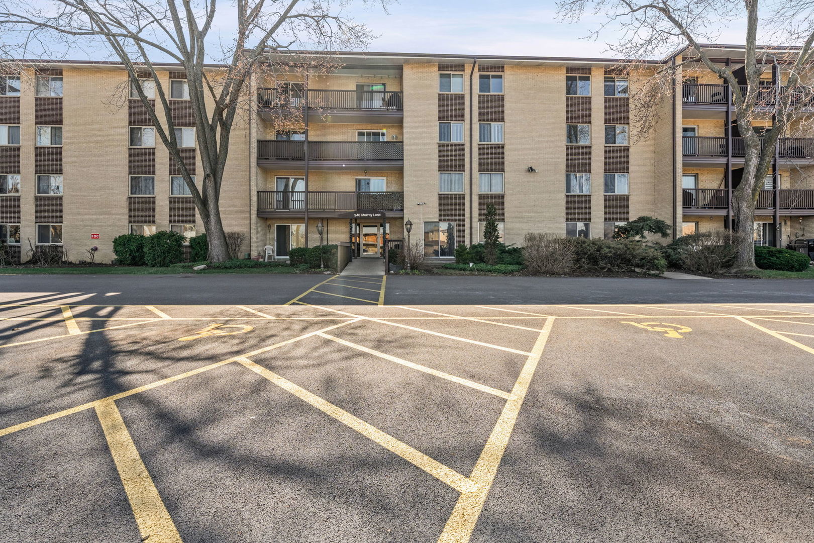 640 Murray Lane, Unit 111 Des Plaines, IL 60016 - Photo 1 of 19 a view of a building with a yard