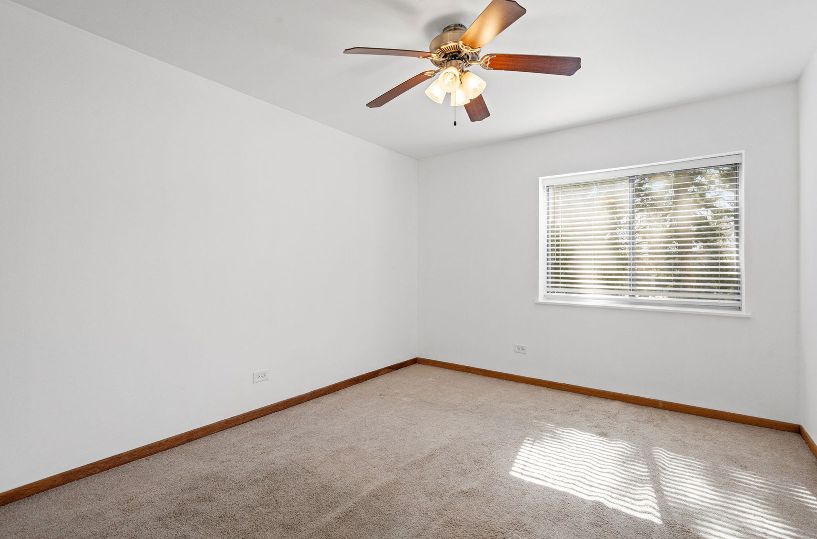 640 Murray Lane, Unit 111 Des Plaines, IL 60016 - Photo 13 of 19 an empty room with a window and a fan