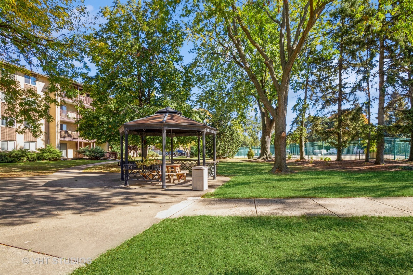640 Murray Lane, Unit 111 Des Plaines, IL 60016 - Photo 16 of 19 a front view of a house with a yard and trees