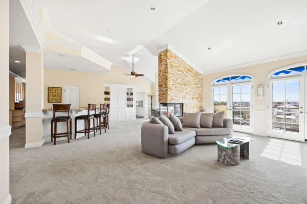 a living room with furniture and a large window