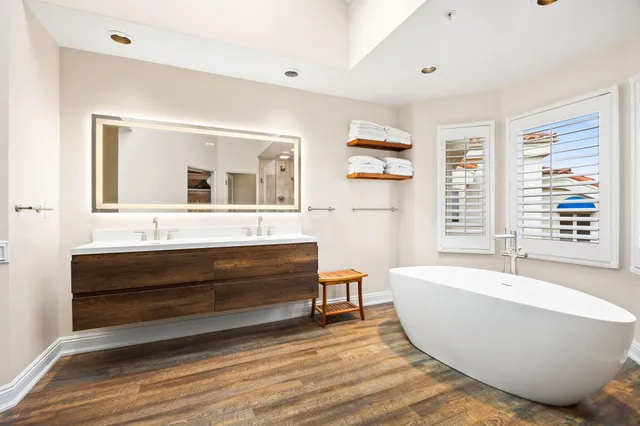 an aerial view of a houses and an outdoor space