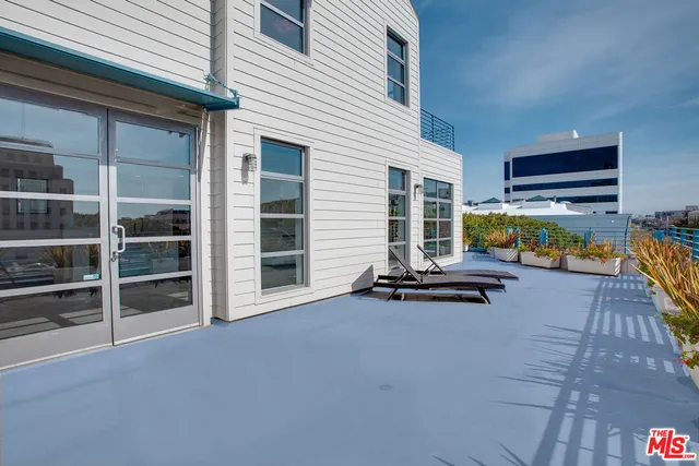 a view of a house with pool table and chairs