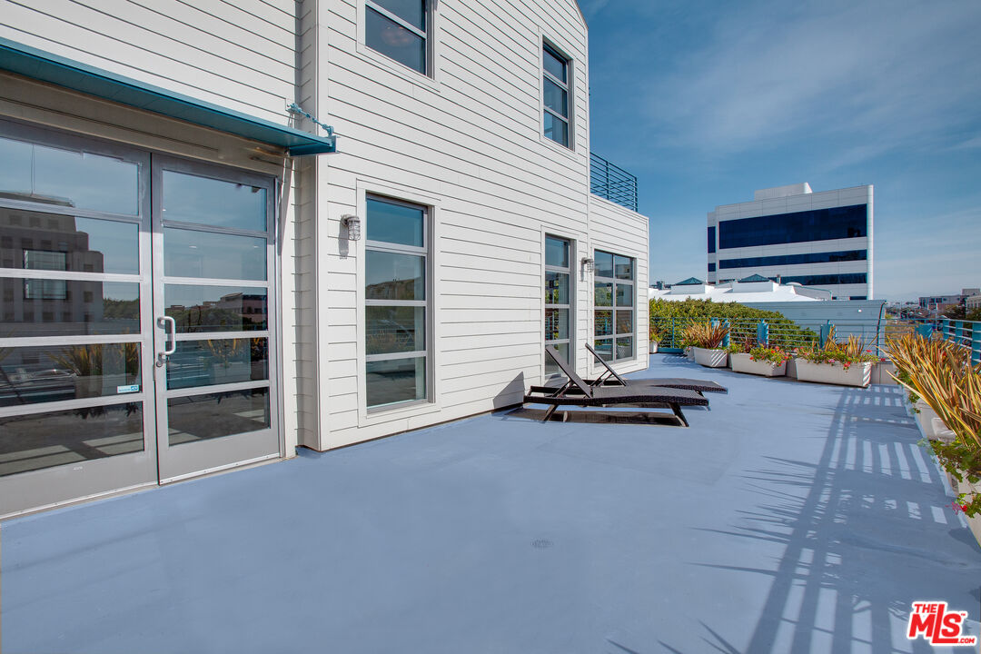 1358 4th Street, Unit A Santa Monica, CA 90401 - Photo 11 of 46 a view of a house with pool table and chairs