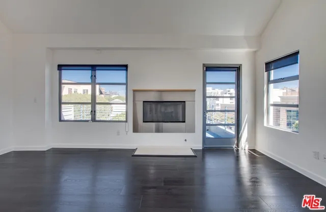 a spacious bathroom with a granite countertop sink mirror and a