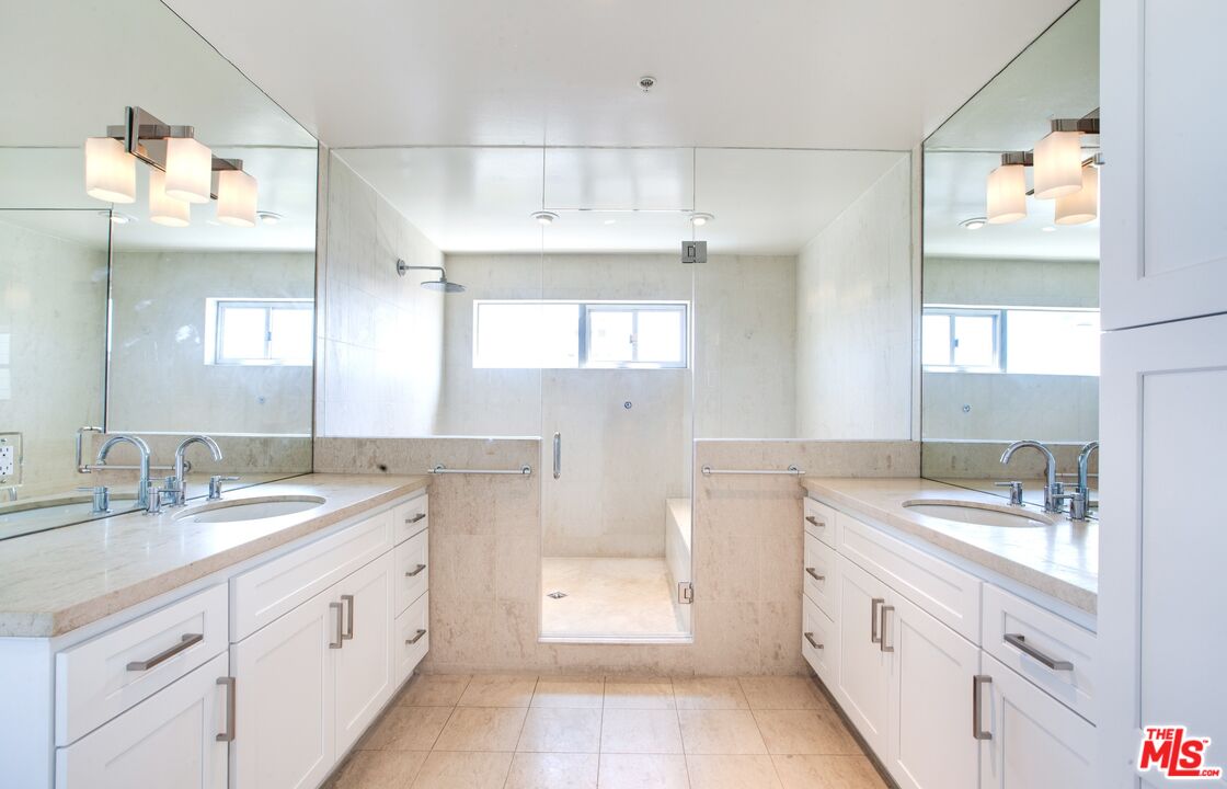 1358 4th Street, Unit A Santa Monica, CA 90401 - Photo 26 of 46 a spacious bathroom with a granite countertop sink mirror and a