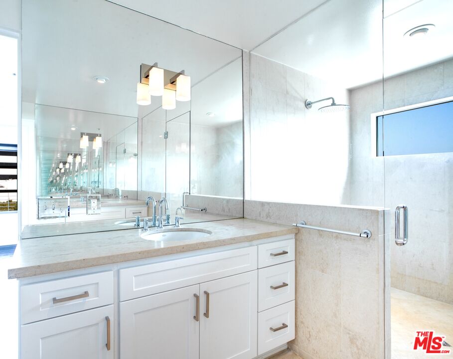 1358 4th Street, Unit A Santa Monica, CA 90401 - Photo 28 of 46 a bathroom with a sink double vanity and a mirror