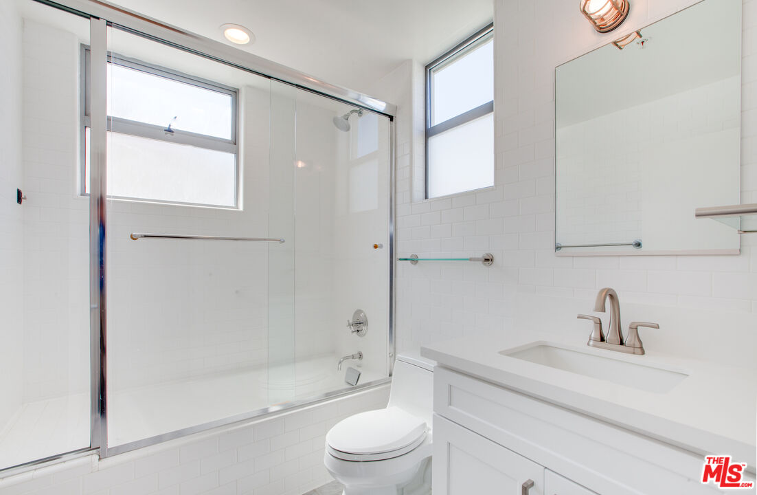 1358 4th Street, Unit A Santa Monica, CA 90401 - Photo 34 of 46 a bathroom with a sink toilet and shower