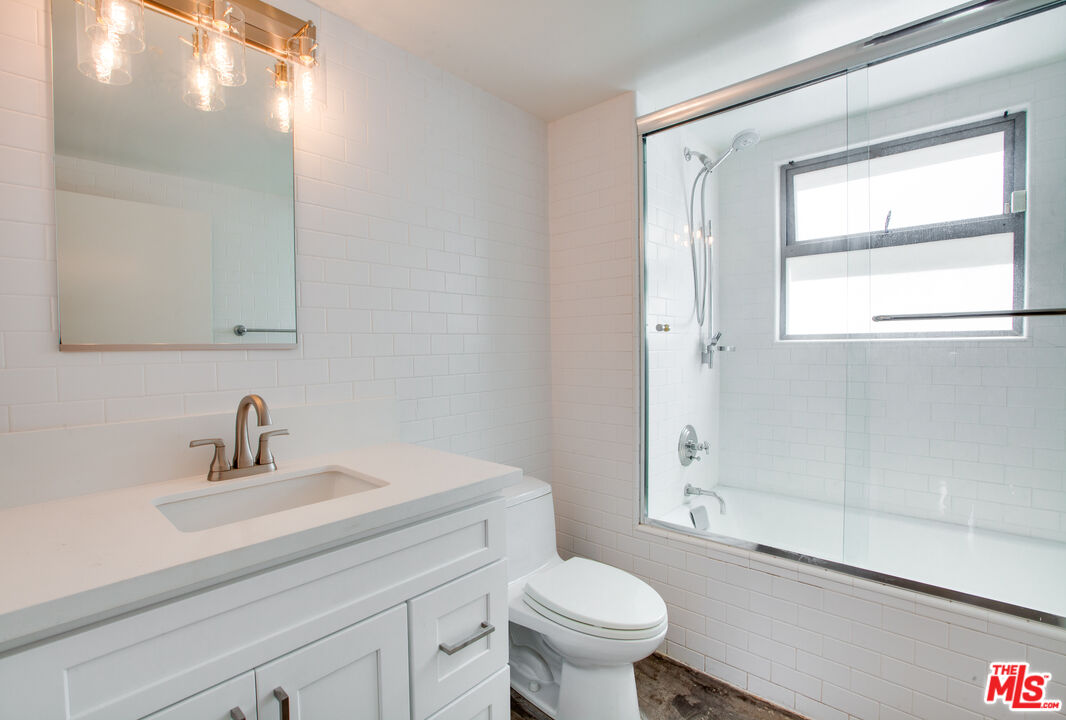 1358 4th Street, Unit A Santa Monica, CA 90401 - Photo 39 of 46 a bathroom with a sink a toilet and shower