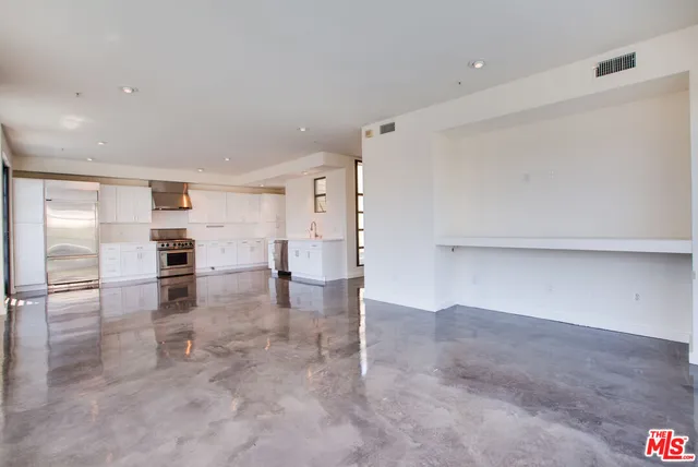 a view of kitchen with furniture and wooden floor
