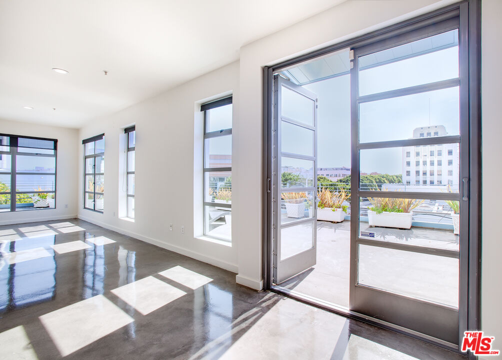 1358 4th Street, Unit A Santa Monica, CA 90401 - Photo 10 of 46 a living room with furniture and large window