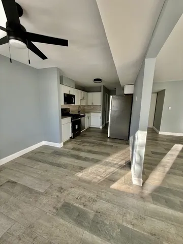 a view of a kitchen with storage and utility