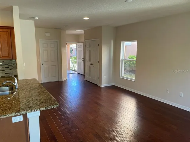 a kitchen with sink and cabinets