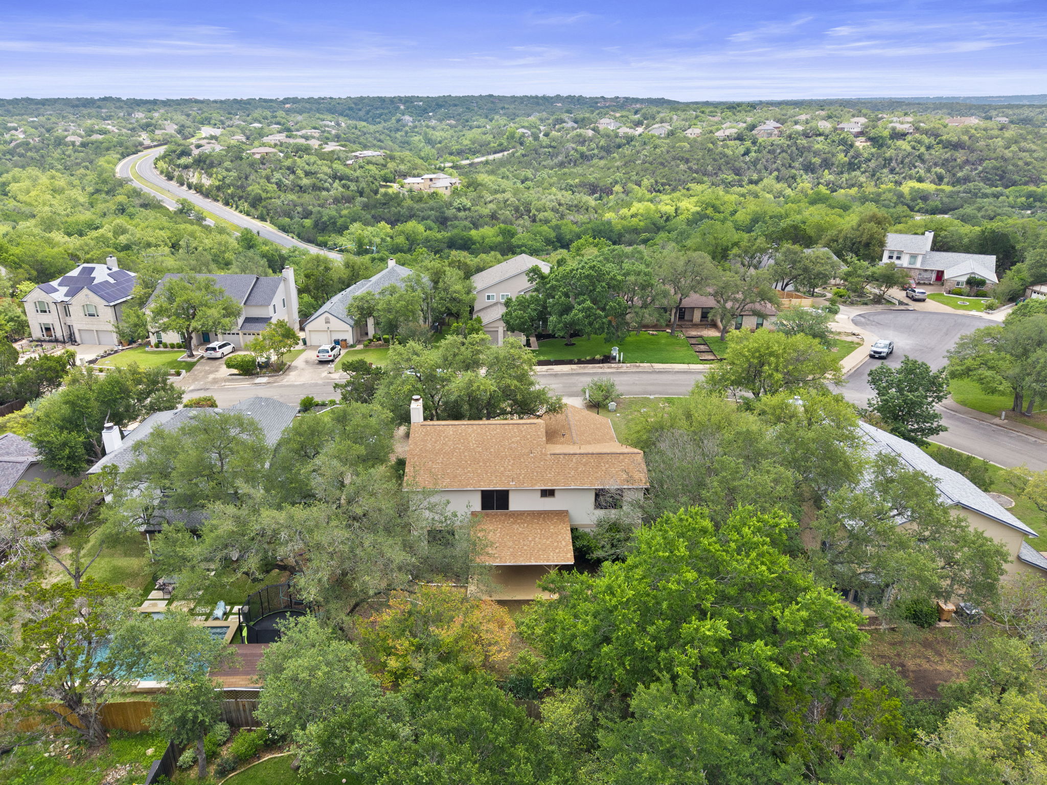 9006 Lockleven Loop Austin, TX 78750 - Photo 14 of 25 a view of a garden with a building in the background