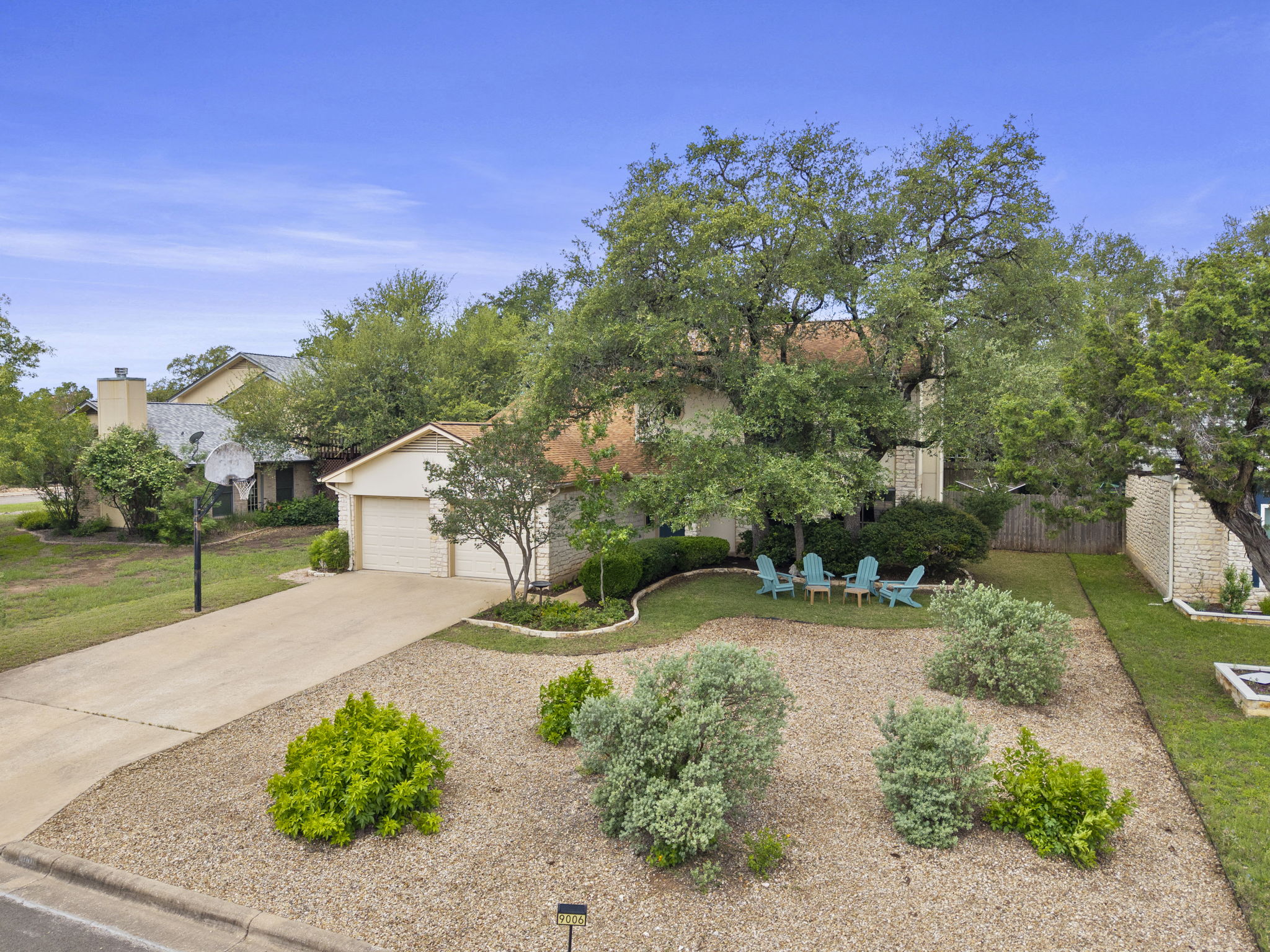 9006 Lockleven Loop Austin, TX 78750 - Photo 15 of 25 a view of a garden with a house in the background