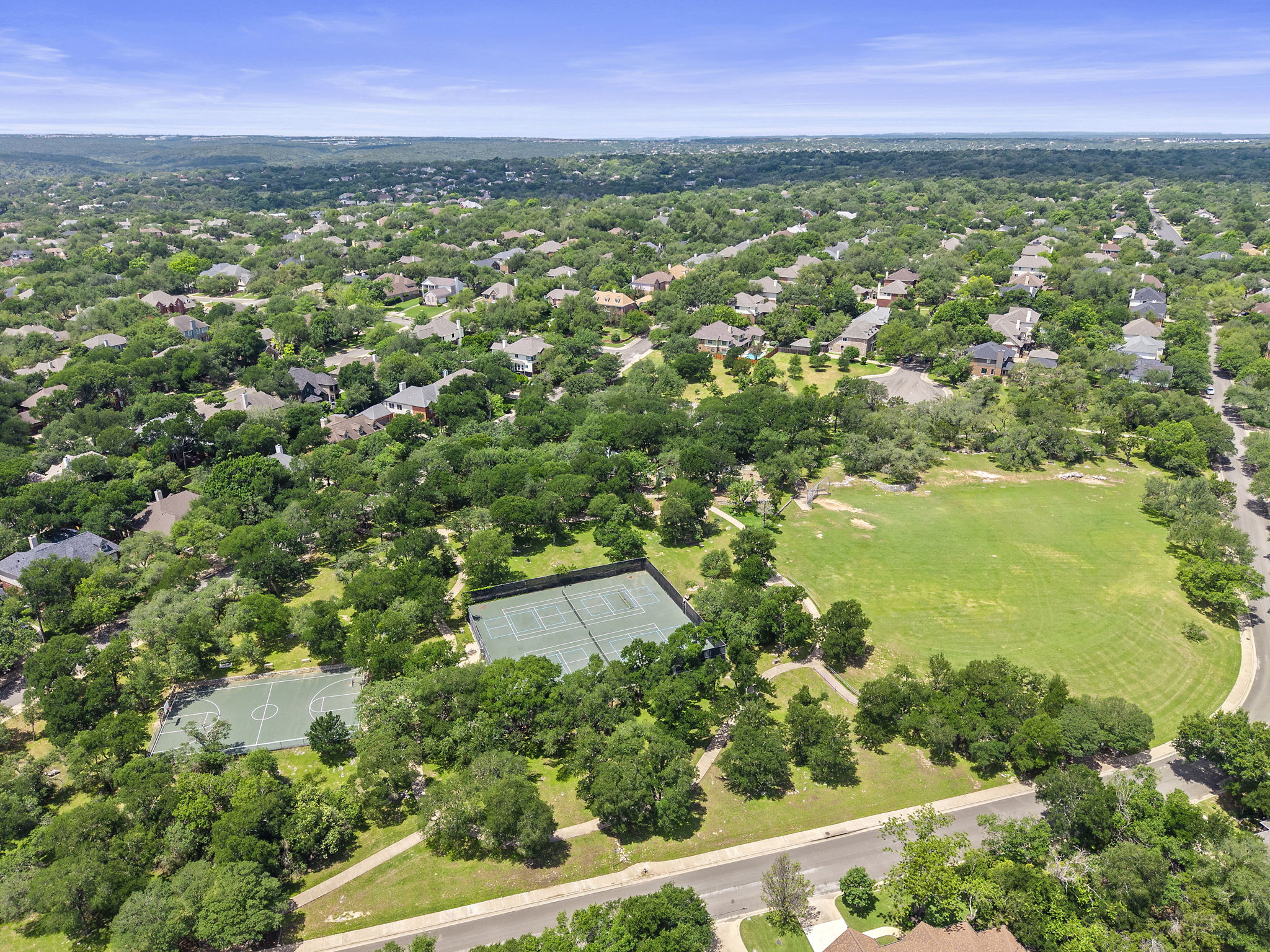 9006 Lockleven Loop Austin, TX 78750 - Photo 25 of 25 an aerial view of residential houses with outdoor space and trees all around