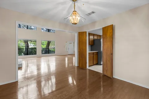a view of an entryway with wooden floor
