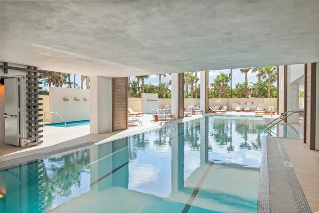 a kitchen with lots of counter top space and painting on the wall