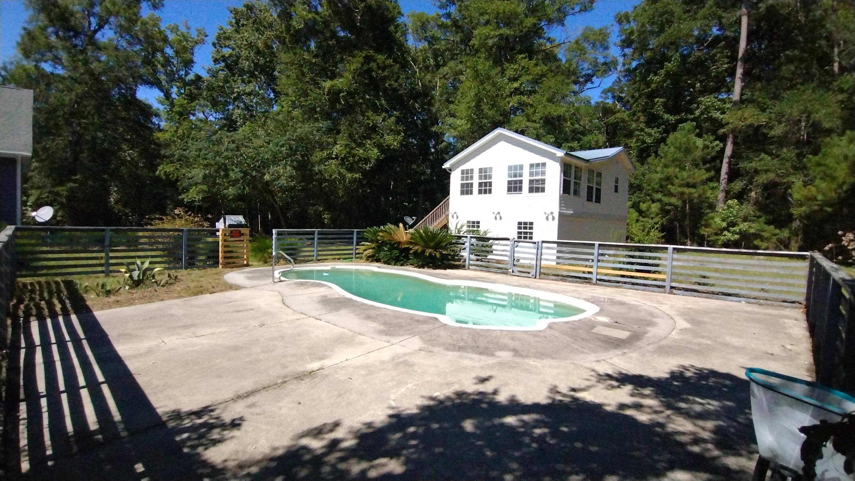 8615 Raccoon Island Road Edisto Island, SC 29438 - Photo 34 of 69 pool and pool house front angle right