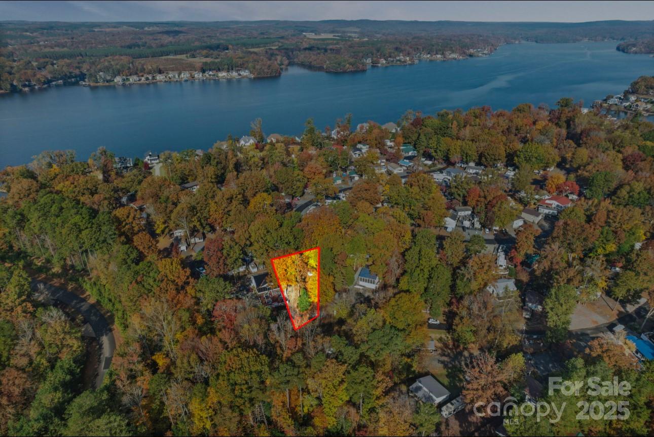 101 Deer Park Road, Unit D3 Mount Gilead, NC 27306 - Photo 2 of 6 an aerial view of a houses with a lake