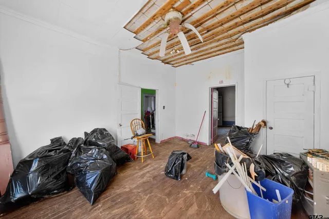 a bed room with a bed and a chandelier