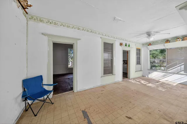 a bedroom with a bed and a chair