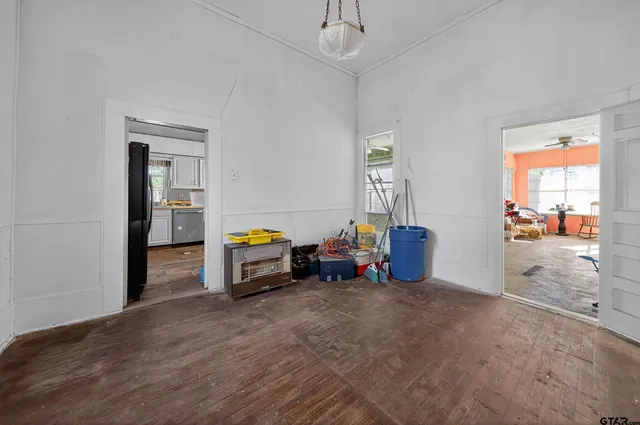 a view of a bedroom with furniture and a window
