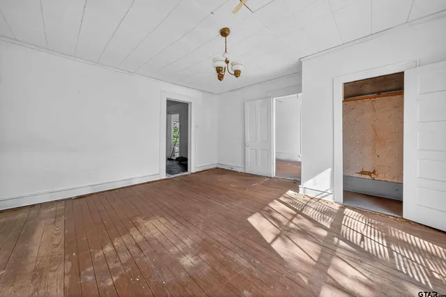 a view of a livingroom with furniture and wooden floor