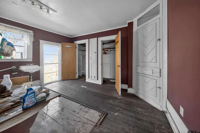 a bed room with furniture and a window