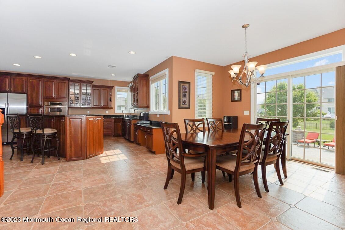 15 Great Bridge Road Freehold, NJ 07728 - Photo 21 of 57 a view of a dining room with furniture window and outside view